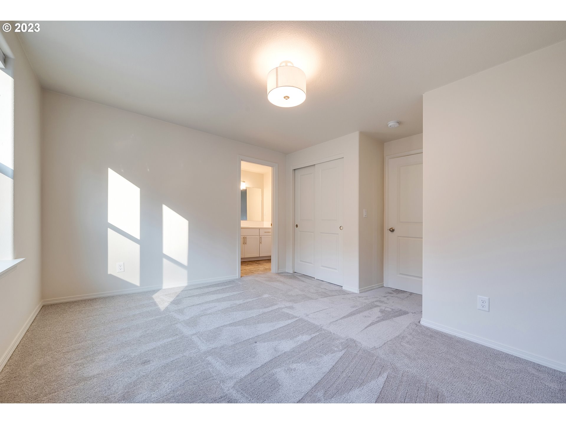 1057 Laura Street Springfield, OR 97477 - Photo 22 of 39 a view of an empty room with a window