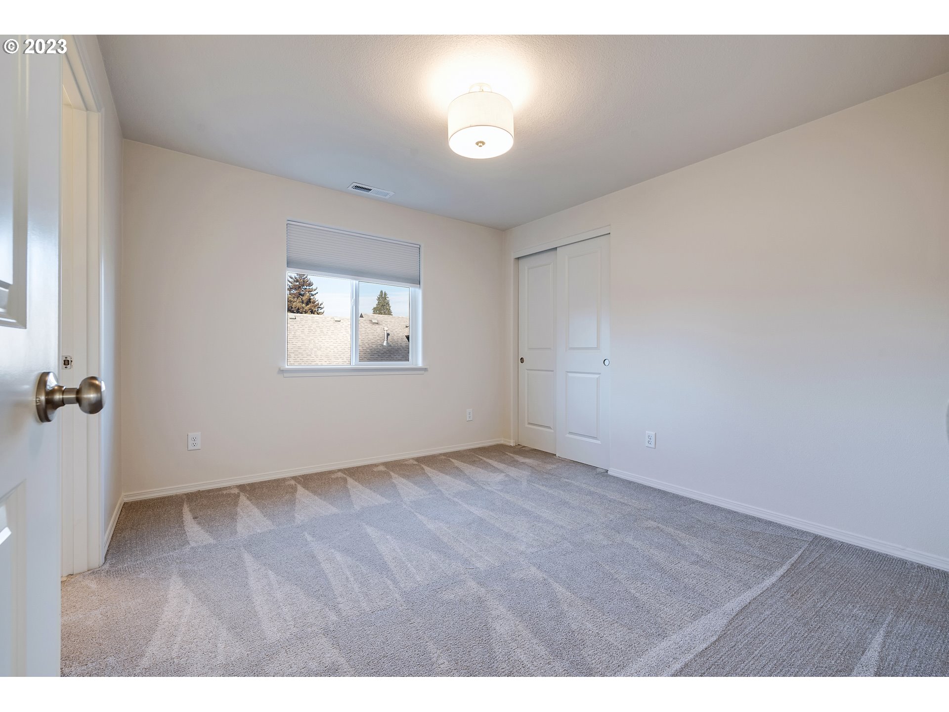 1057 Laura Street Springfield, OR 97477 - Photo 25 of 39 a view of an empty room with a window
