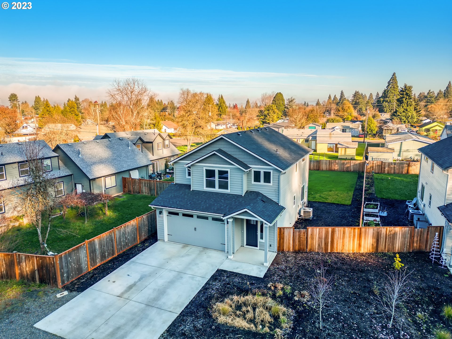 1057 Laura Street Springfield, OR 97477 - Photo 31 of 39 a view of a house with wooden fence