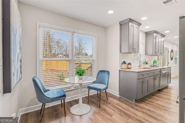 a room with granite countertop furniture and a wooden floor