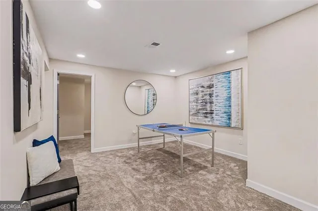 a view of a dining room with furniture and fan