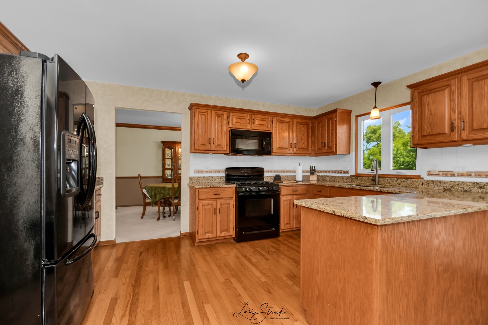 19407 Cherry Street Mokena, IL 60448 - Photo 15 of 33 a kitchen with stainless steel appliances granite countertop a refrigerator a stove top oven a sink and dishwasher