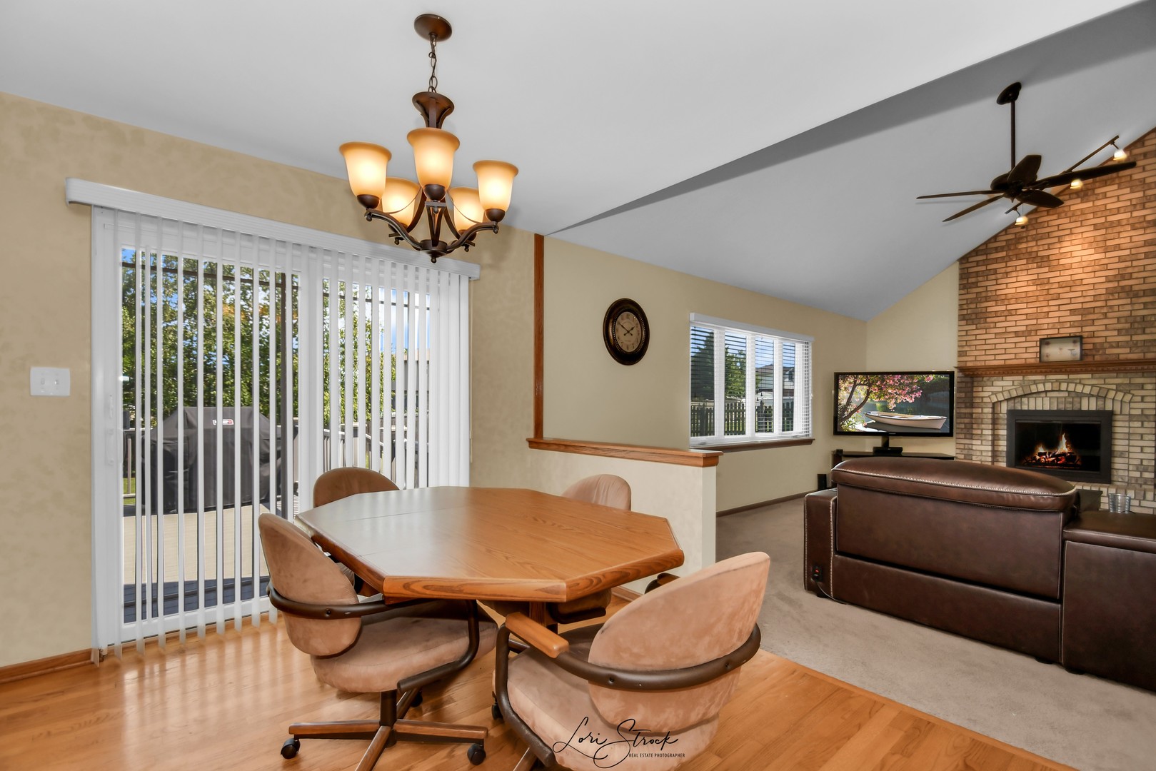 19407 Cherry Street Mokena, IL 60448 - Photo 16 of 33 a dining room with furniture a chandelier and wooden floor