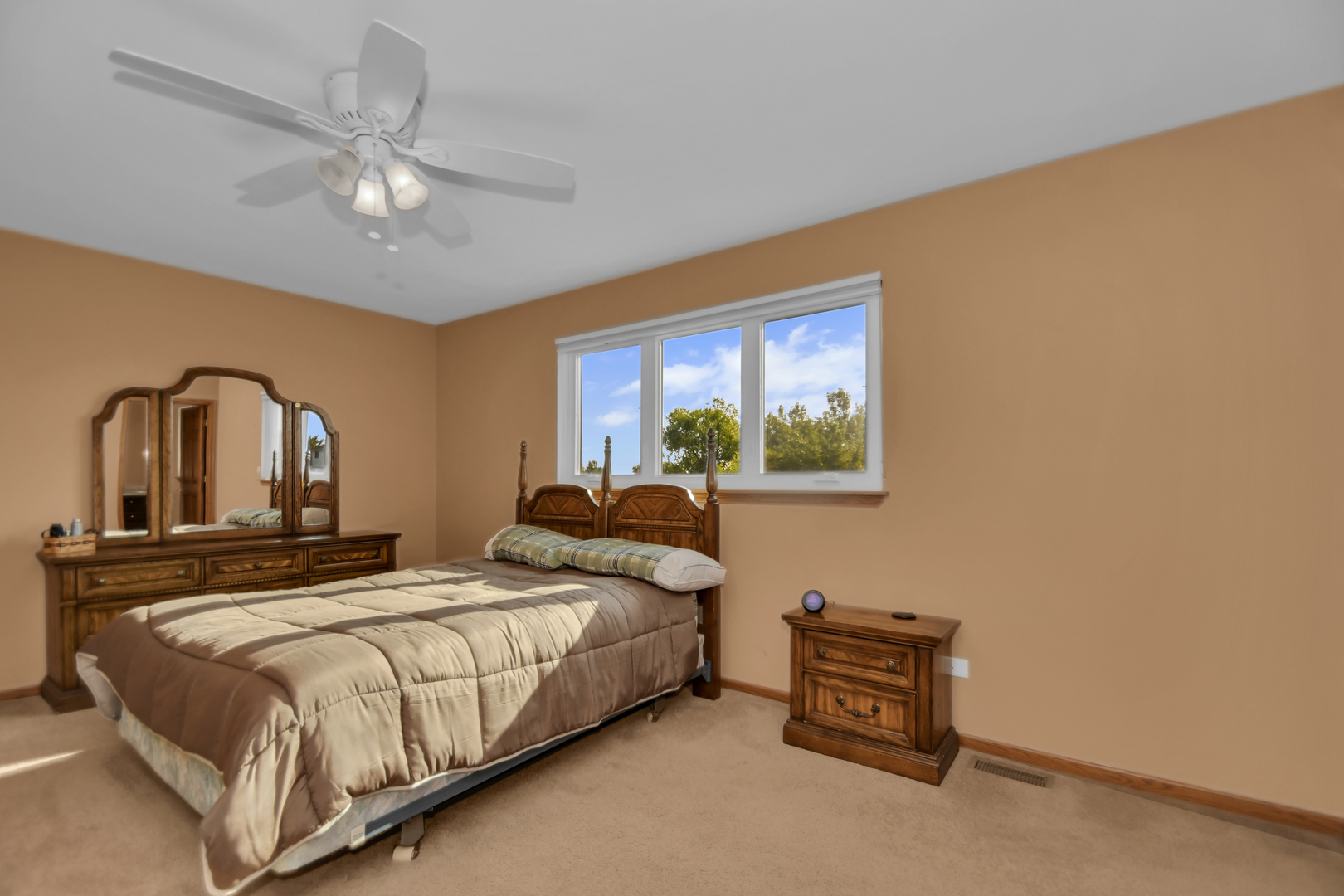 19407 Cherry Street Mokena, IL 60448 - Photo 30 of 33 a bedroom with a bed and a chandelier