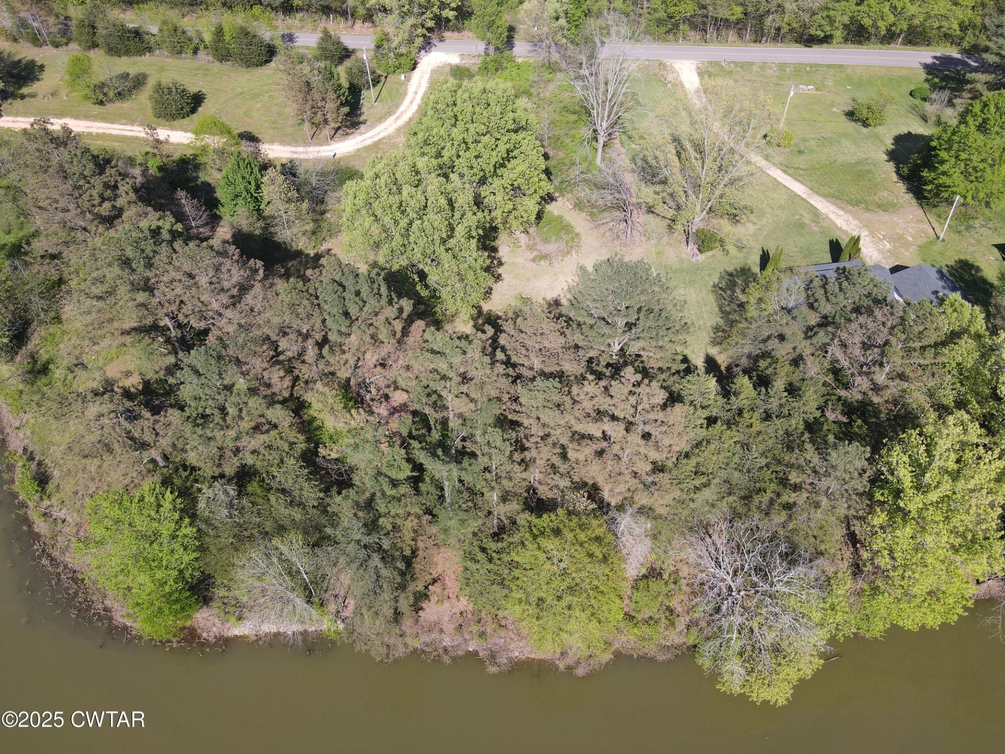 0 Mount Carmel Road Decaturville, TN 38329 - Photo 3 of 6 a view of a lake with a yard