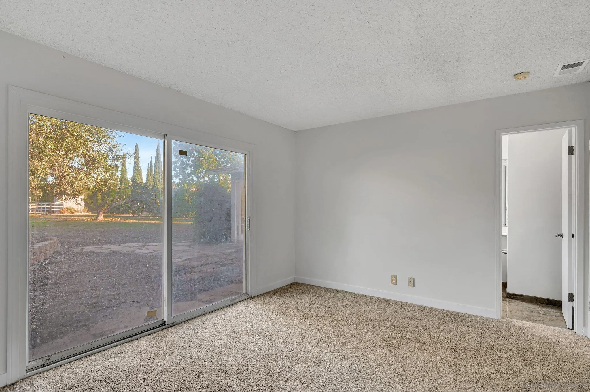 13455 Olive Tree Lane Poway, CA 92064 - Photo 14 of 36 a view of an empty room with glass door