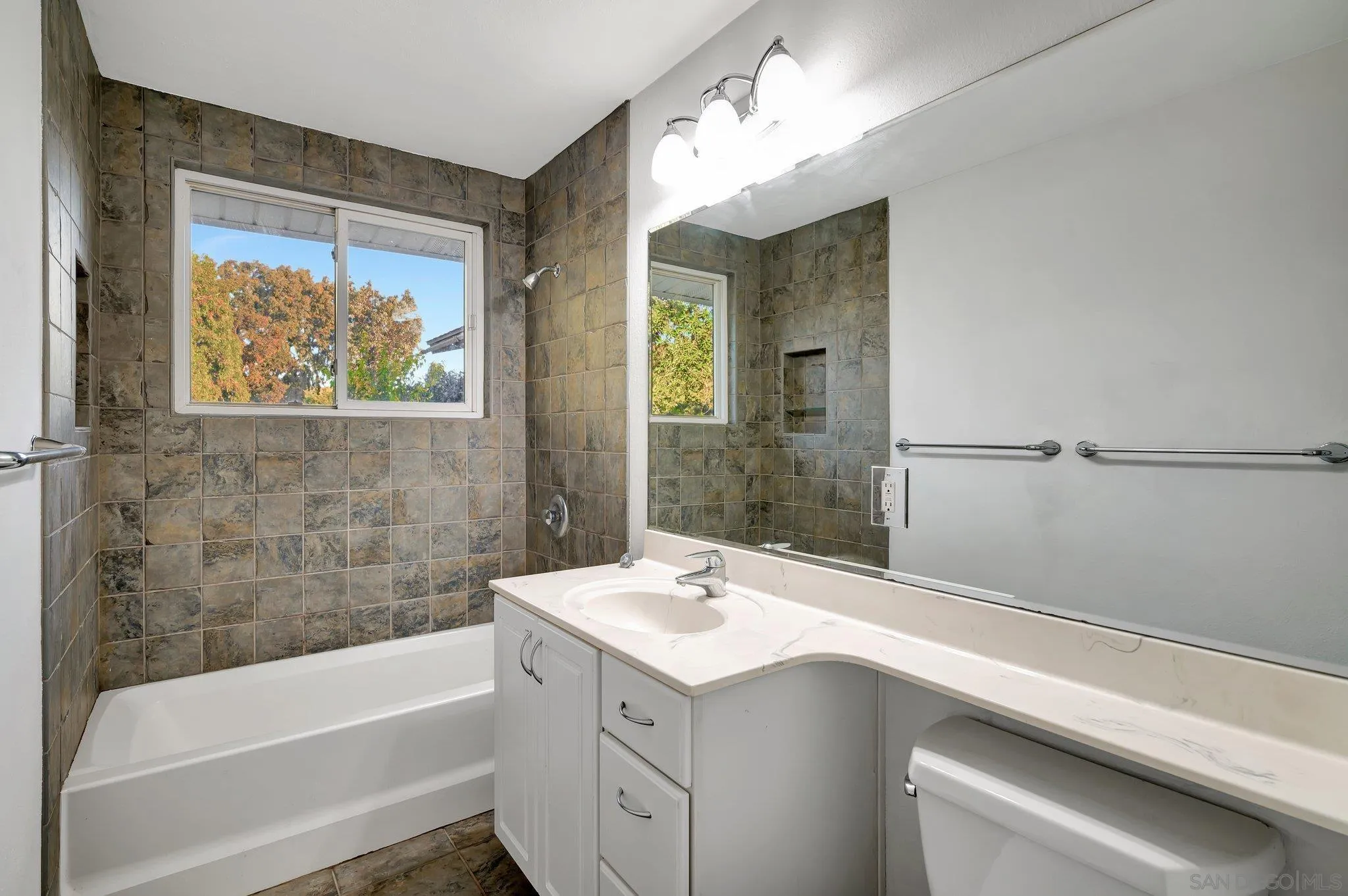 13455 Olive Tree Lane Poway, CA 92064 - Photo 17 of 36 a bathroom with a tub sink and mirror