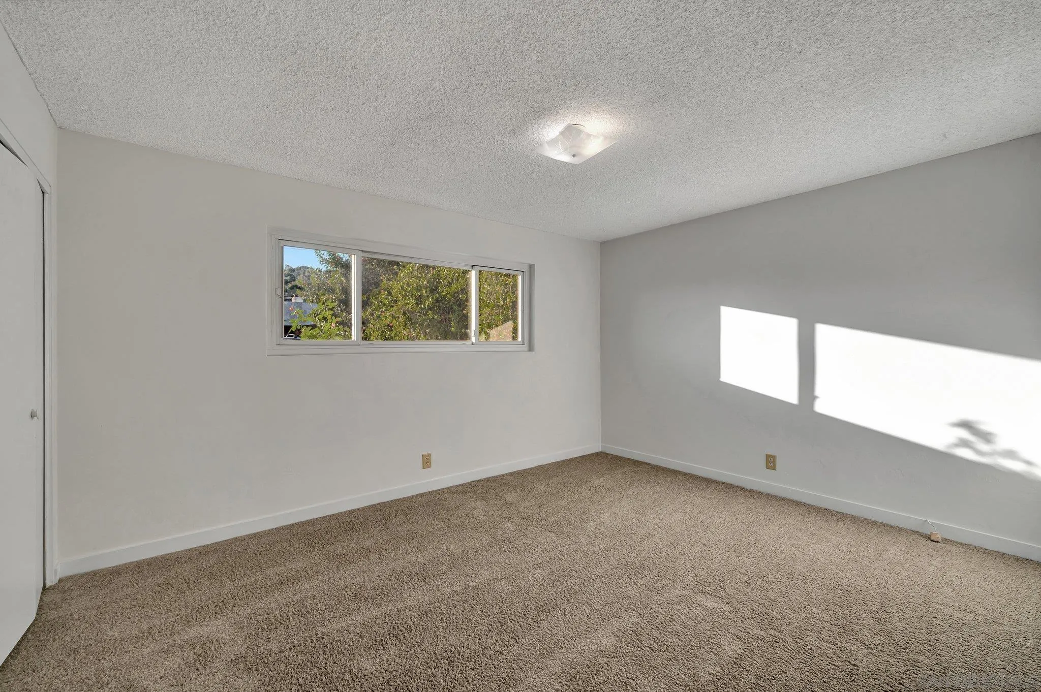 13455 Olive Tree Lane Poway, CA 92064 - Photo 18 of 36 an empty room with windows