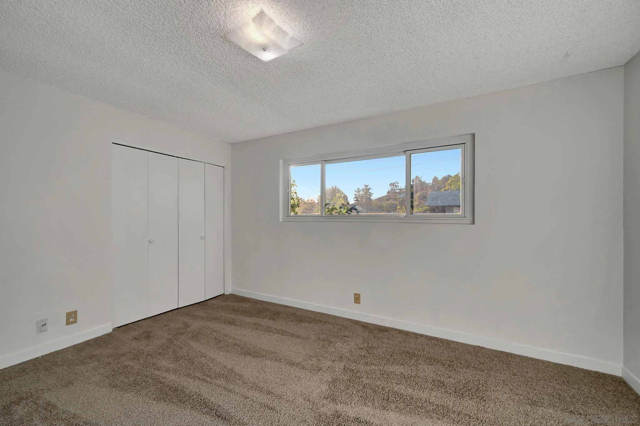 13455 Olive Tree Lane Poway, CA 92064 - Photo 19 of 36 an empty room with a window
