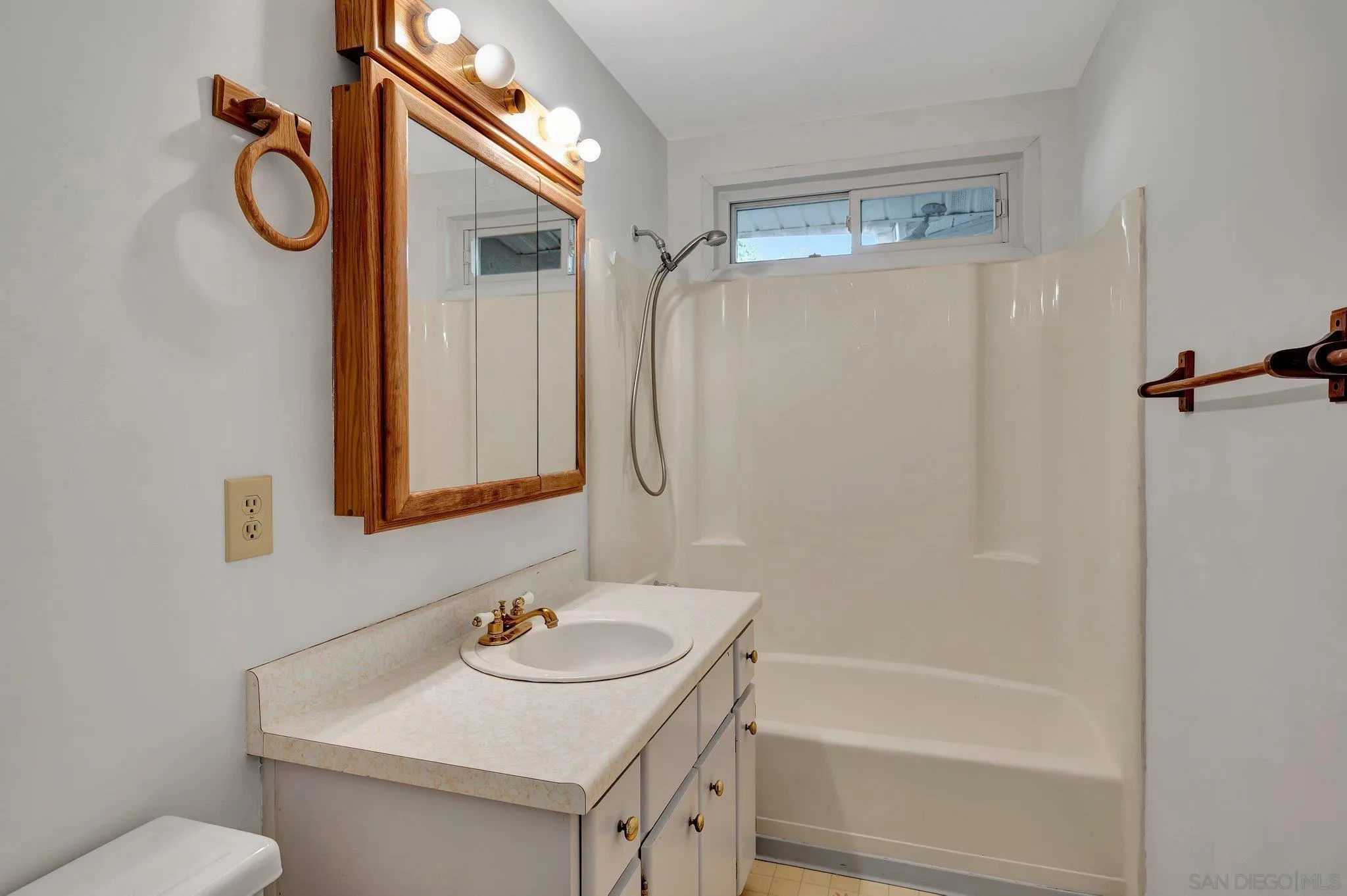 13455 Olive Tree Lane Poway, CA 92064 - Photo 20 of 36 a bathroom with a sink and a mirror