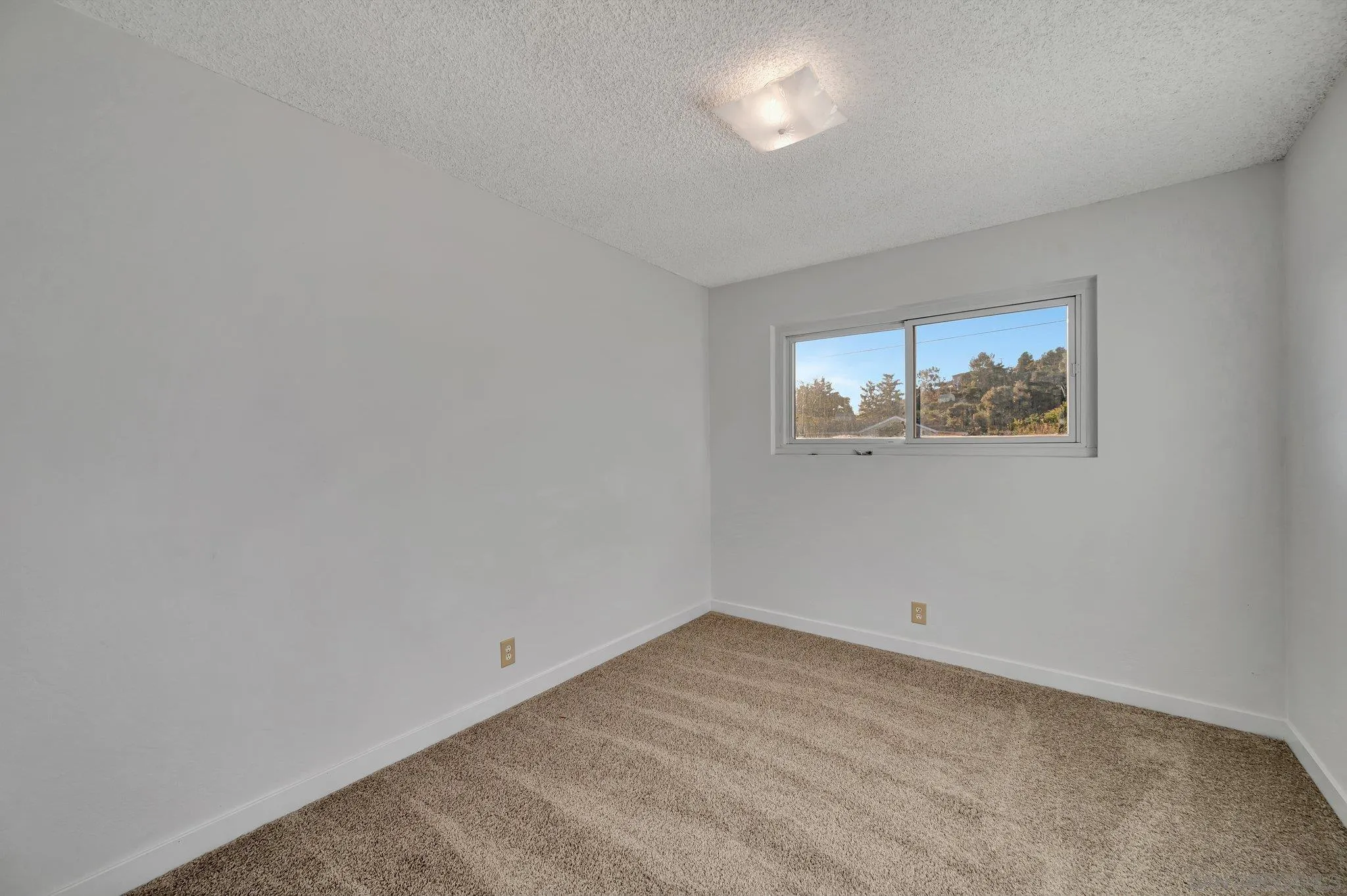13455 Olive Tree Lane Poway, CA 92064 - Photo 21 of 36 an empty room with a window