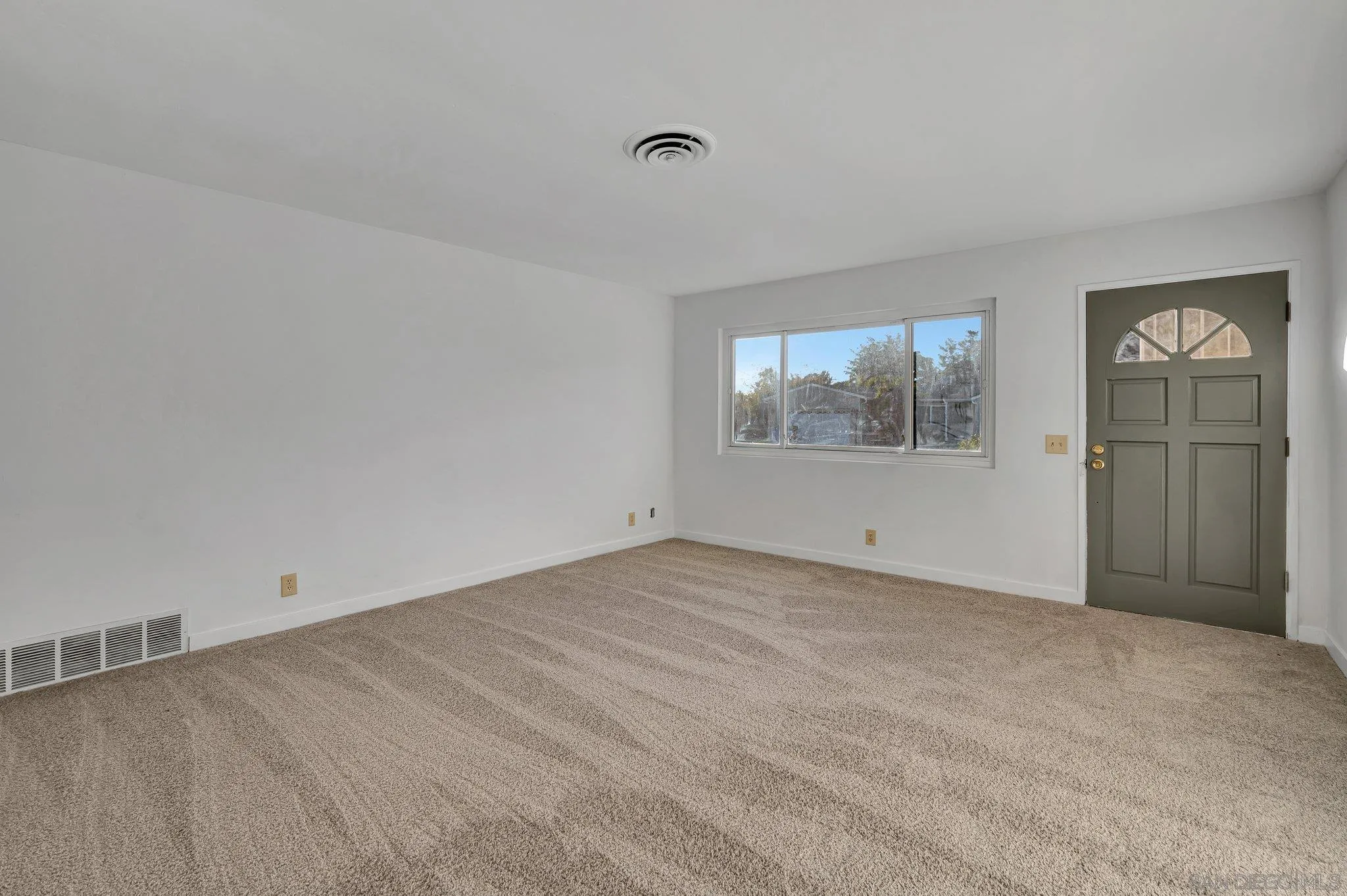 13455 Olive Tree Lane Poway, CA 92064 - Photo 3 of 36 an empty room with windows