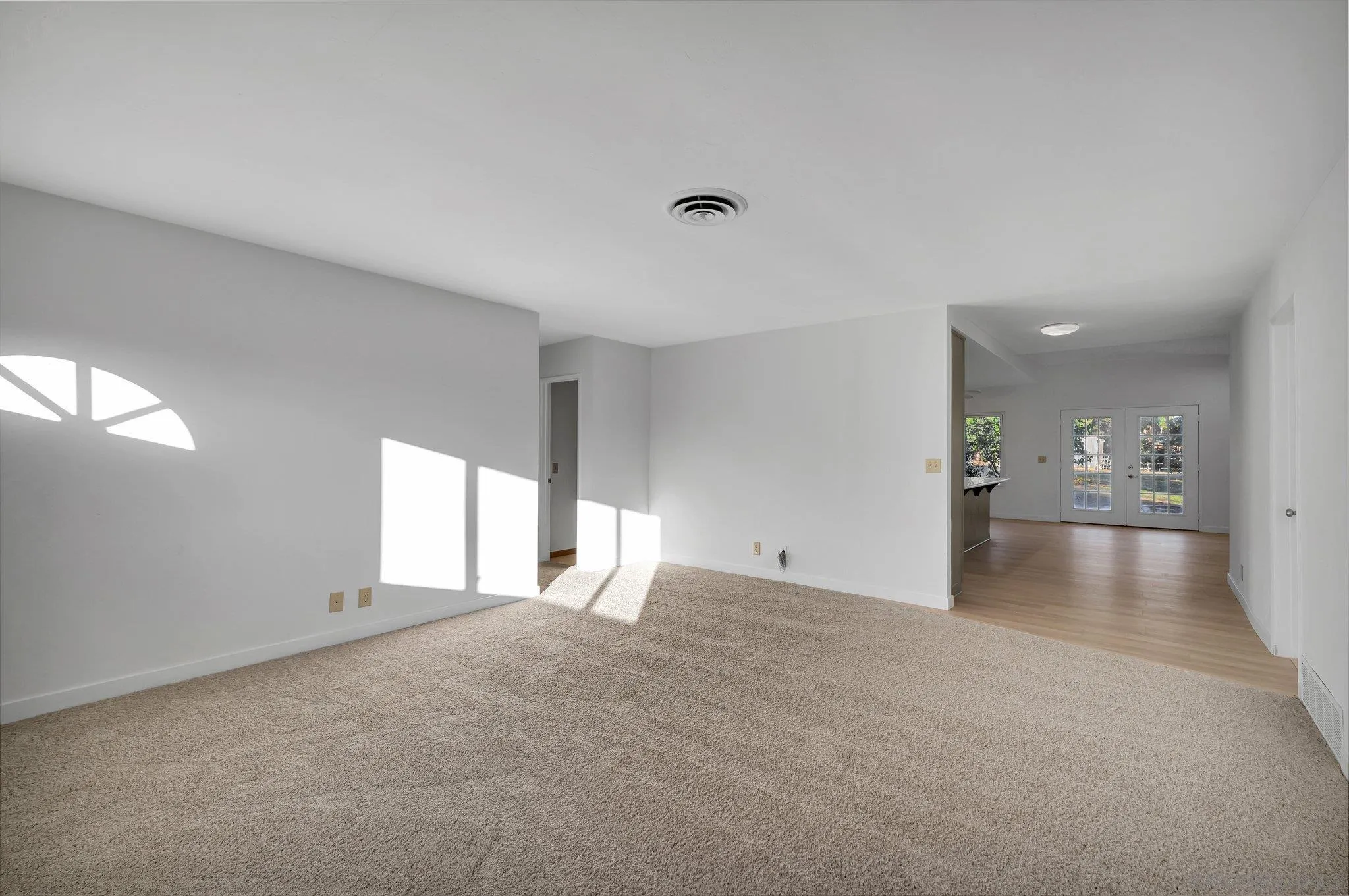 13455 Olive Tree Lane Poway, CA 92064 - Photo 5 of 36 a view of empty room with wooden floor and windows