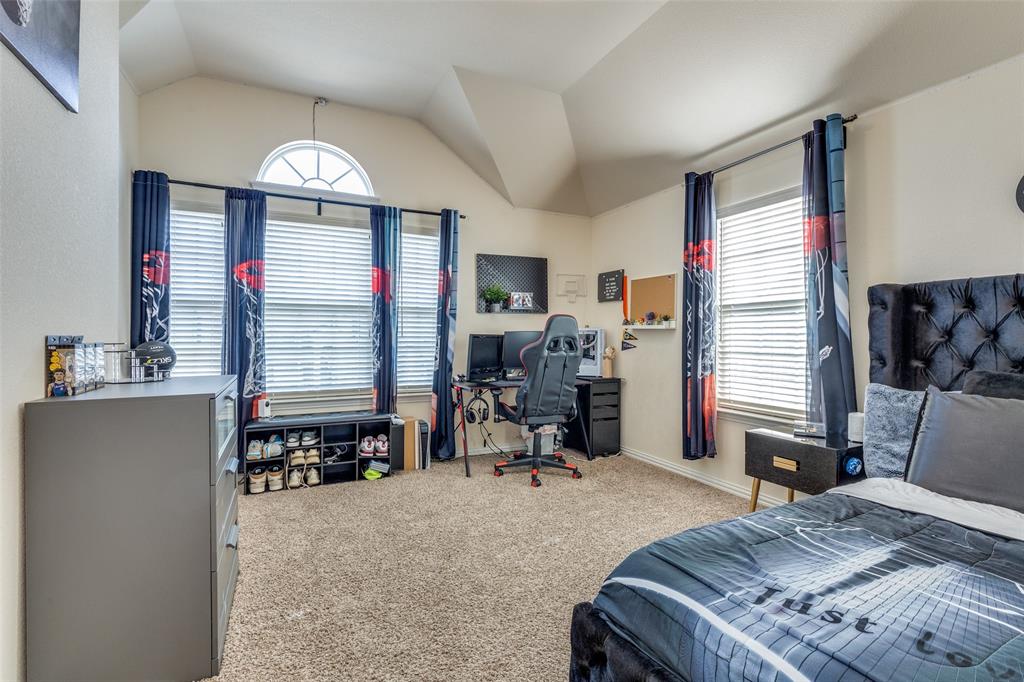 1324 Needle Cactus Drive Fort Worth, TX 76177 - Photo 17 of 36 a bed room with a bed and a chair