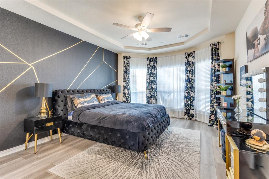 1324 Needle Cactus Drive Fort Worth, TX 76177 - Photo 21 of 36 a bedroom with a bed and a chandelier