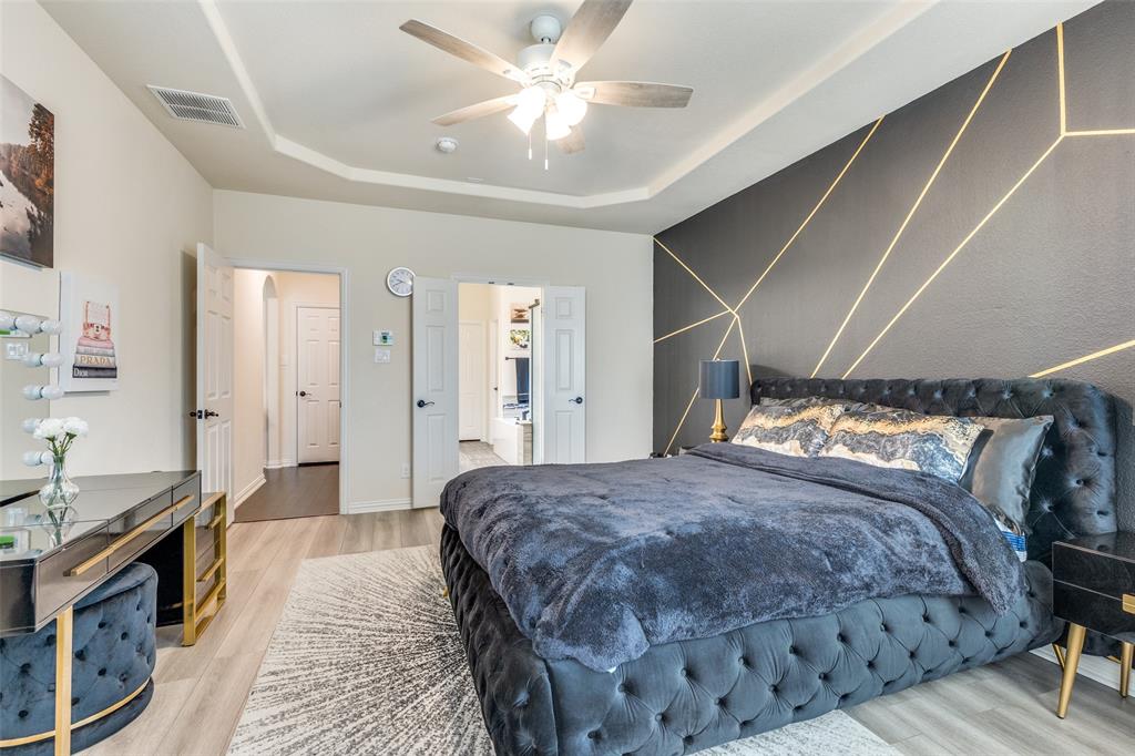 1324 Needle Cactus Drive Fort Worth, TX 76177 - Photo 22 of 36 a bedroom with a bed and a walk in closet