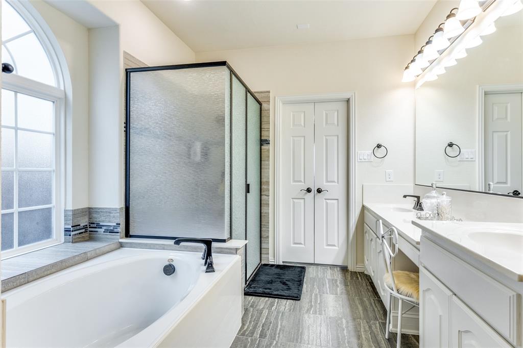 1324 Needle Cactus Drive Fort Worth, TX 76177 - Photo 23 of 36 a bathroom with a tub sink and mirror