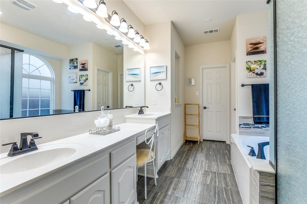 1324 Needle Cactus Drive Fort Worth, TX 76177 - Photo 24 of 36 a spacious bathroom with a granite countertop sink mirror and shower