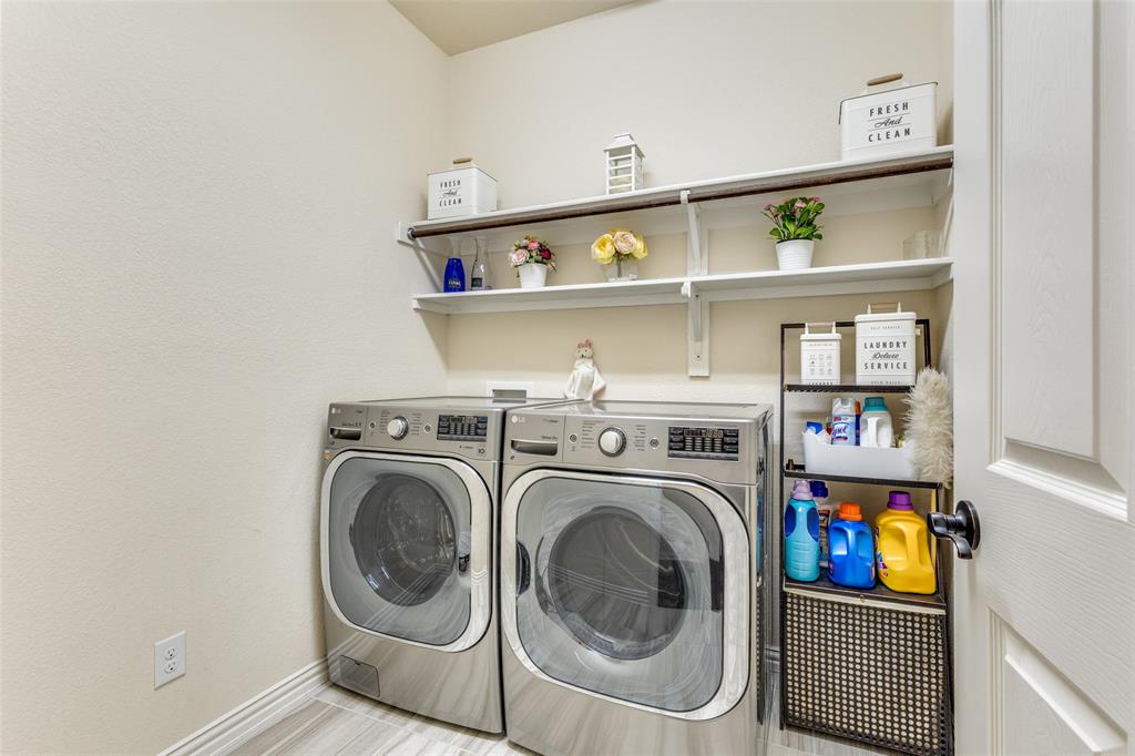 1324 Needle Cactus Drive Fort Worth, TX 76177 - Photo 30 of 36 a view of washer and dryer in a shelf