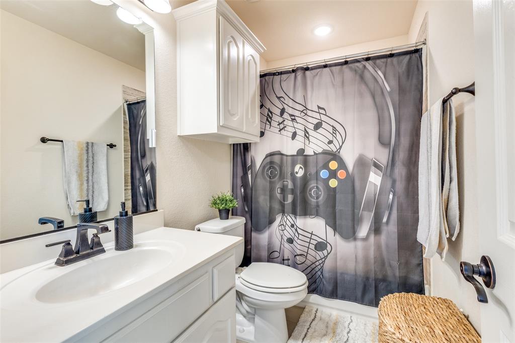 1324 Needle Cactus Drive Fort Worth, TX 76177 - Photo 31 of 36 a bathroom with a sink toilet and shower