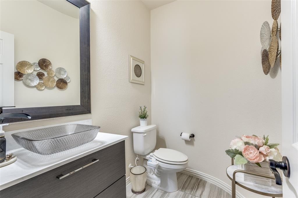 1324 Needle Cactus Drive Fort Worth, TX 76177 - Photo 32 of 36 a bathroom with a sink mirror and toilet