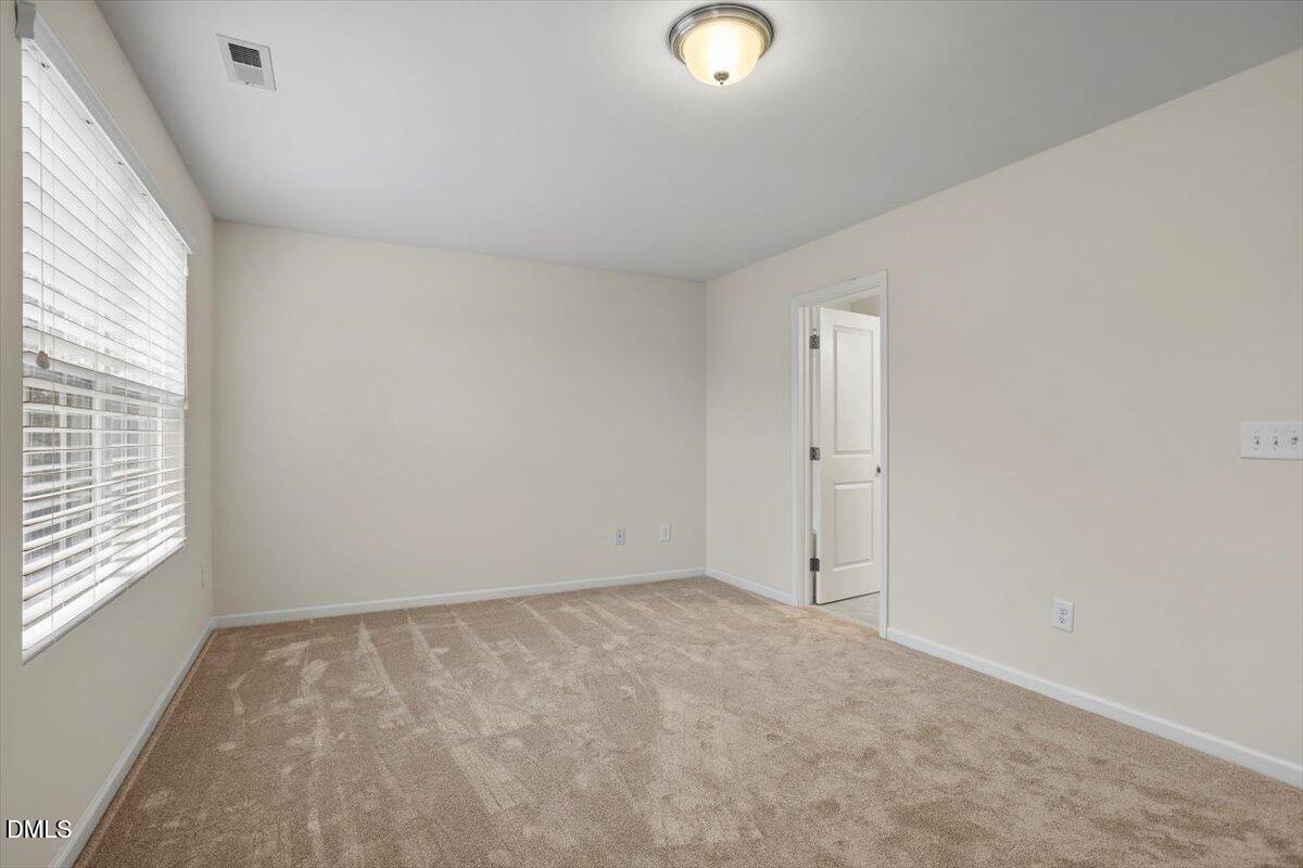2306 Stoney Spring Drive Raleigh, NC 27610 - Photo 16 of 35 an empty room with a window