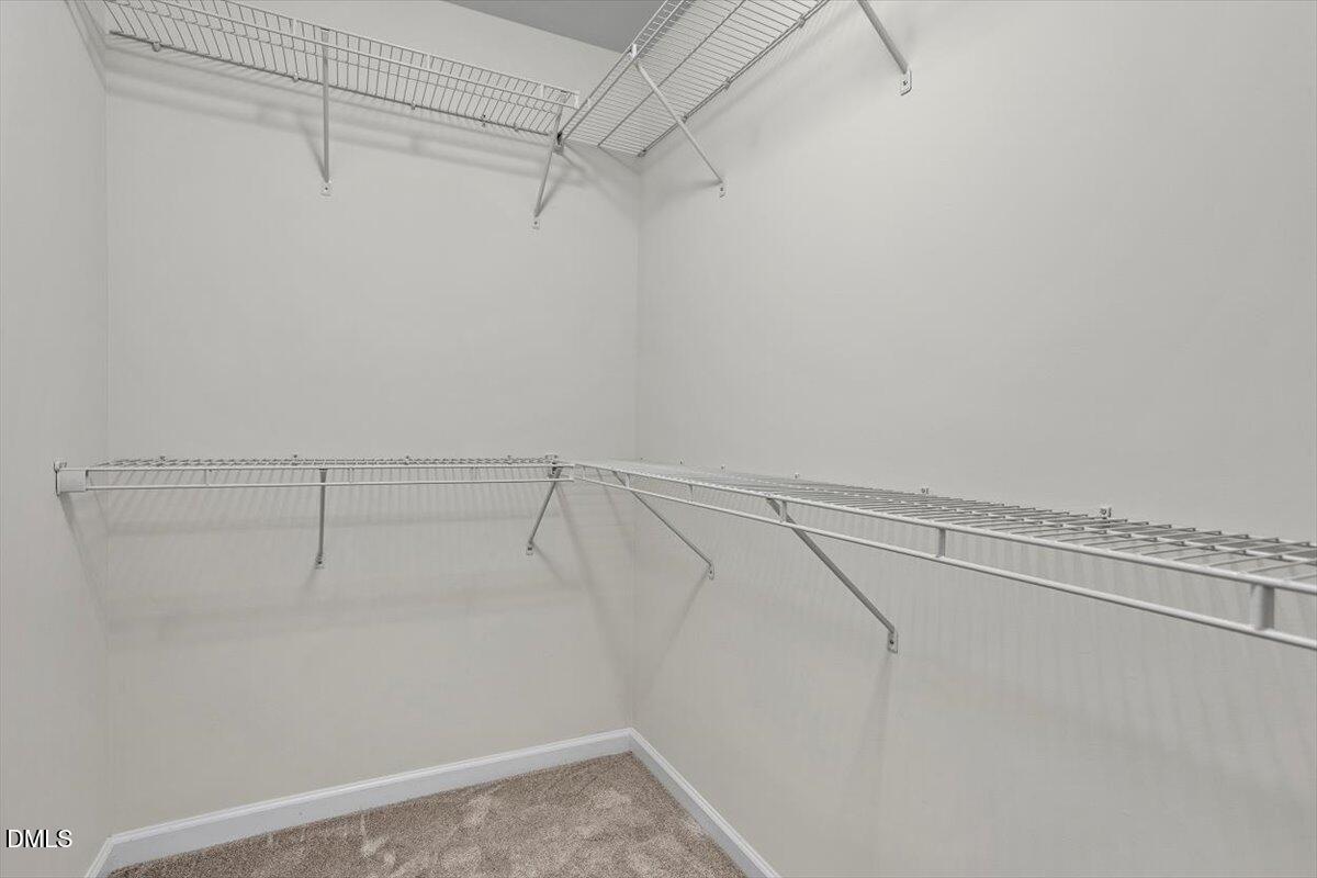 2306 Stoney Spring Drive Raleigh, NC 27610 - Photo 20 of 35 a view of a room with racks on the wall