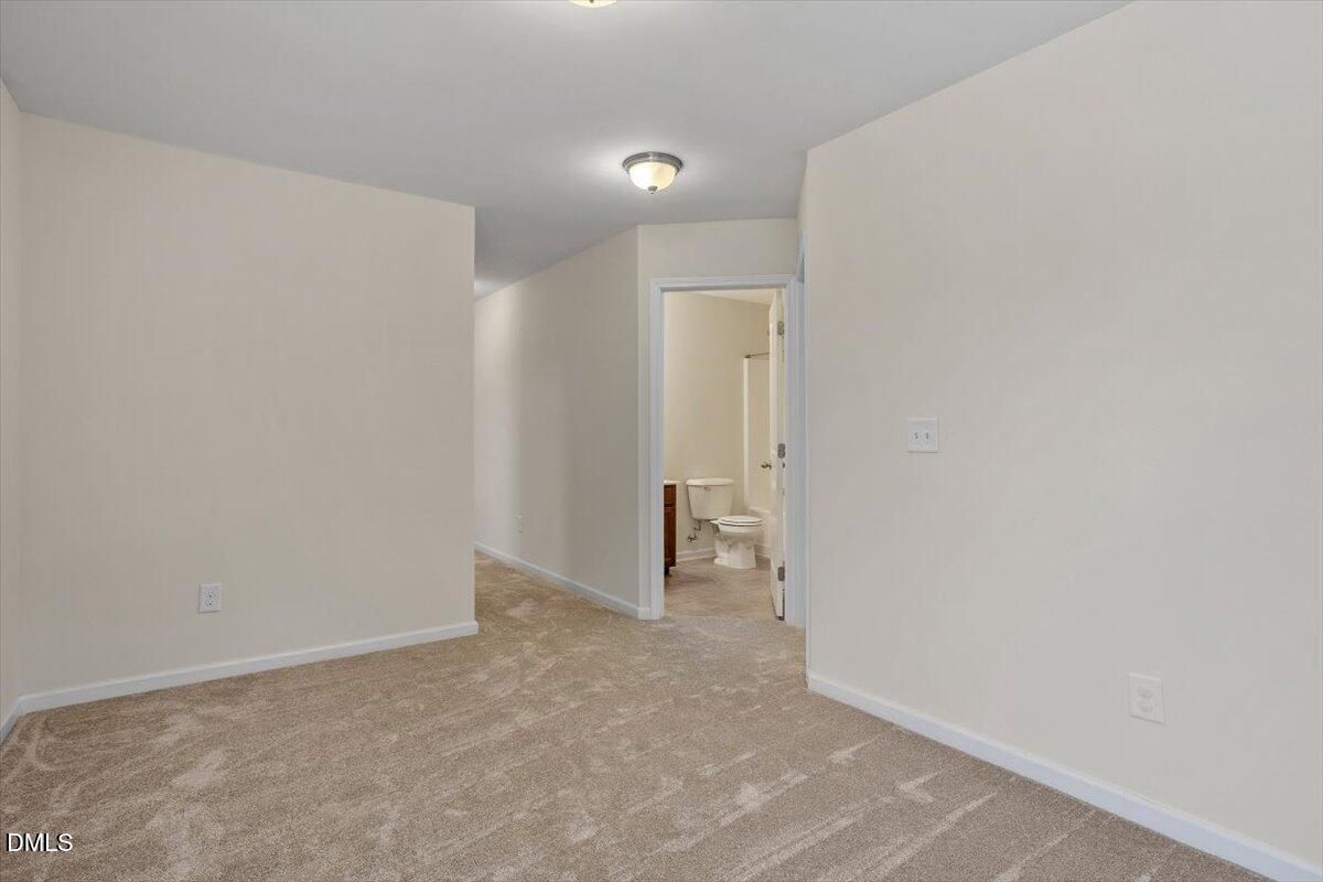 2306 Stoney Spring Drive Raleigh, NC 27610 - Photo 22 of 35 a view of an empty room
