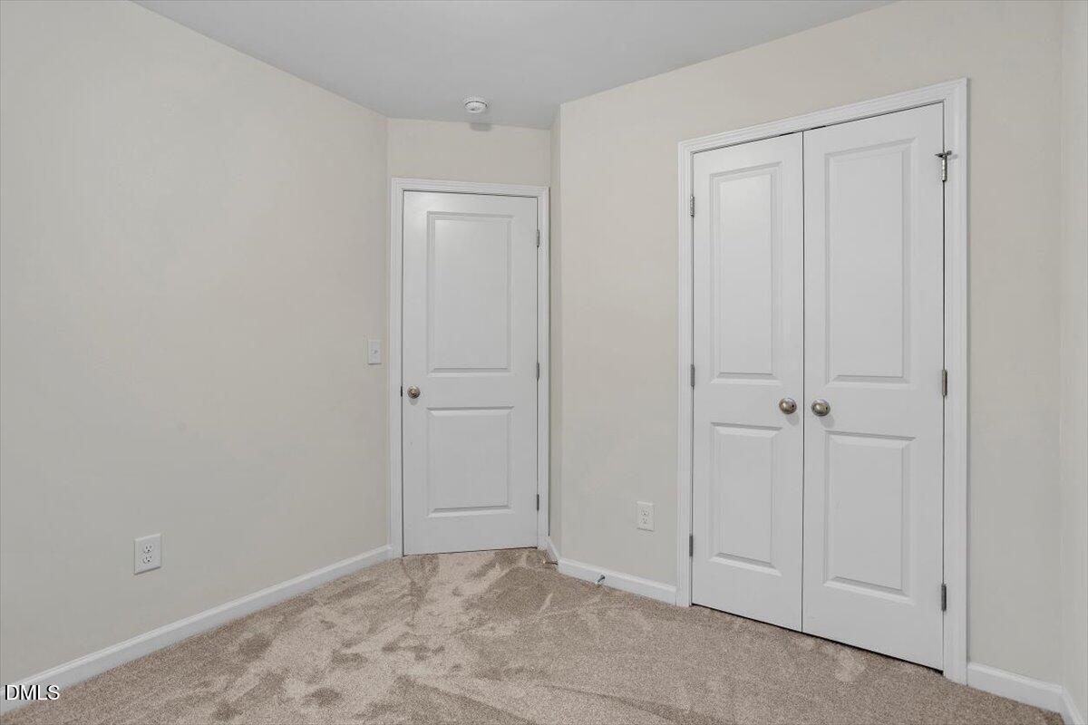 2306 Stoney Spring Drive Raleigh, NC 27610 - Photo 24 of 35 a view of an empty room