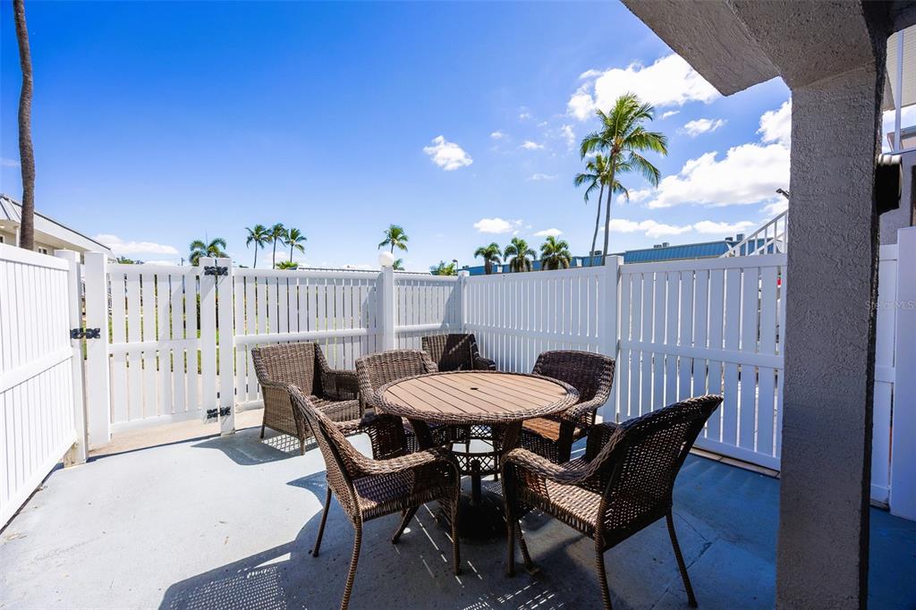6777 Winkler Road, Unit 150 Fort Myers, FL 33919 - Photo 25 of 48 a view of a table and chairs in patio
