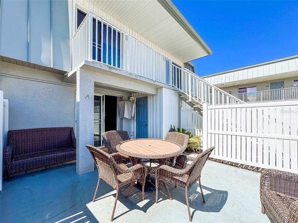 6777 Winkler Road, Unit 150 Fort Myers, FL 33919 - Photo 26 of 48 a view of a dining room with furniture and wooden floor