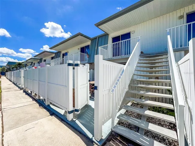 a view of a balcony with staircase