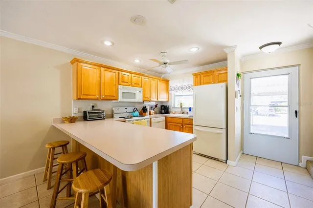 a kitchen with a refrigerator a stove a sink and a refrigerator