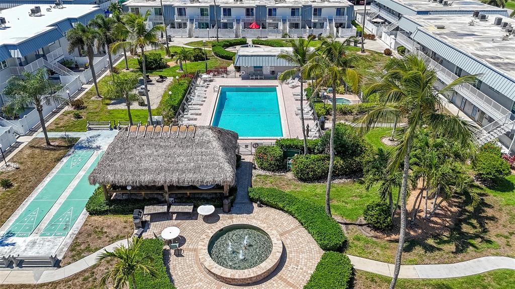 6777 Winkler Road, Unit 150 Fort Myers, FL 33919 - Photo 45 of 48 an aerial view of a house with garden space and lake view