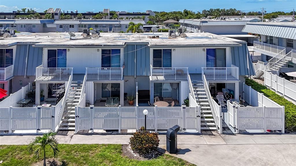 6777 Winkler Road, Unit 150 Fort Myers, FL 33919 - Photo 48 of 48 a view of a house with a sink and garden in the background