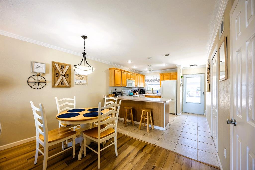 6777 Winkler Road, Unit 150 Fort Myers, FL 33919 - Photo 10 of 48 a view of a dining room with furniture