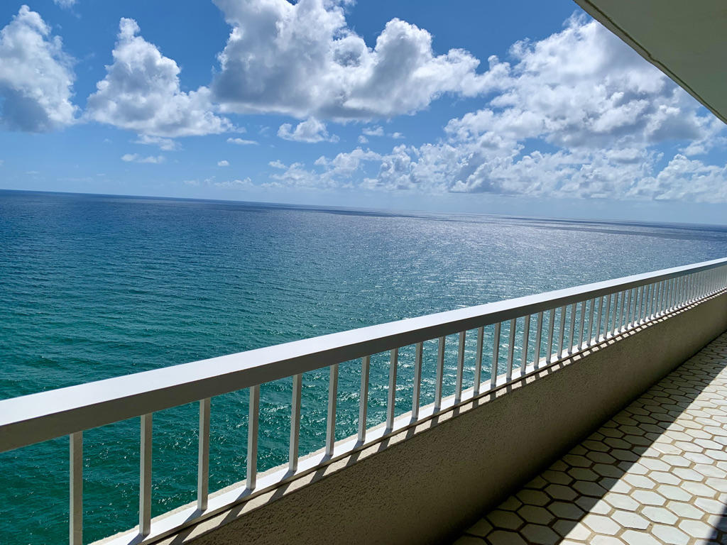 a balcony with an ocean view