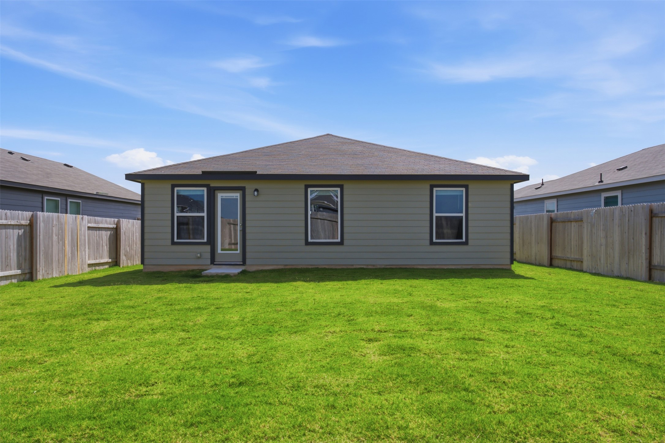 121 Honey Bee Road Jarrell, TX 76537 - Photo 21 of 25 a backyard of a house with lots of green space