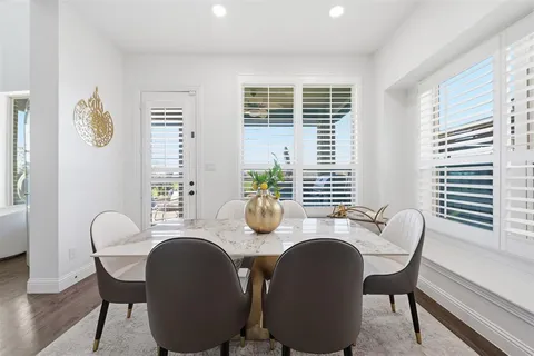 a dining room with furniture and windows