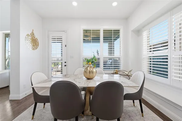 a dining room with furniture and windows