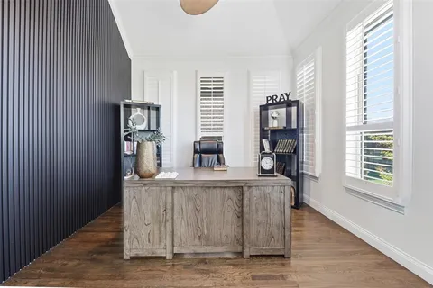 a kitchen with kitchen island stainless steel appliances a sink and a refrigerator