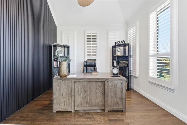 a kitchen with kitchen island stainless steel appliances a sink and a refrigerator