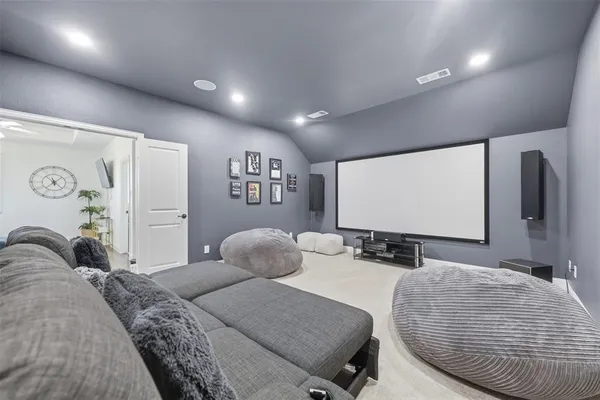 a bedroom with a bed and glass wall