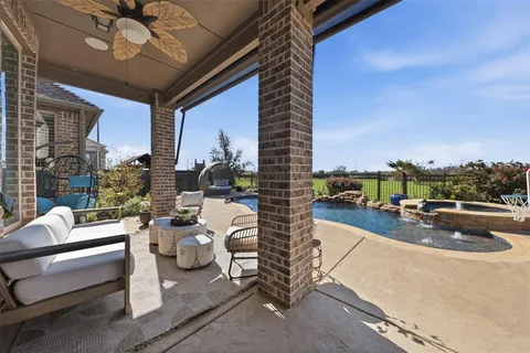 a view of a patio with couches and potted plants