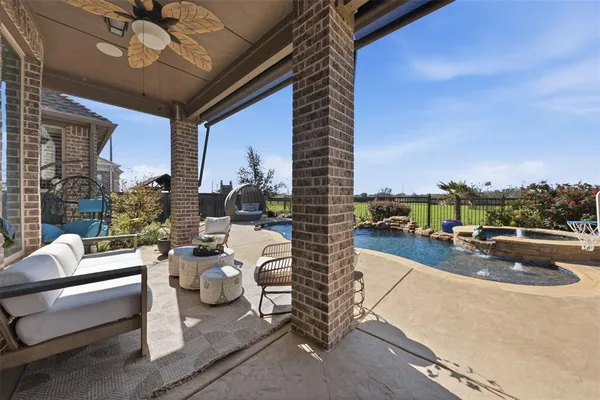 a view of a patio with couches and potted plants