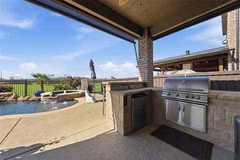 a kitchen with stainless steel appliances granite countertop a stove and a sink
