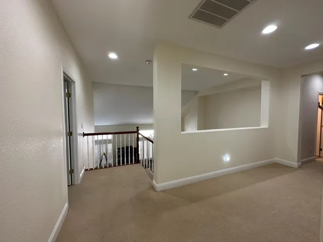 a view of hallway with natural light