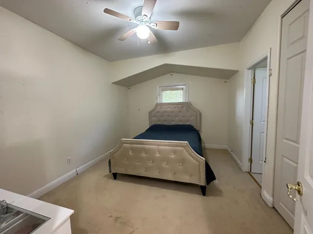 a spacious bathroom with a vanity a sink and a mirror