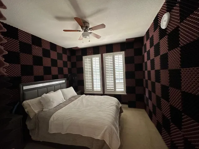 a bathroom with a granite countertop sink a mirror and a bathtub