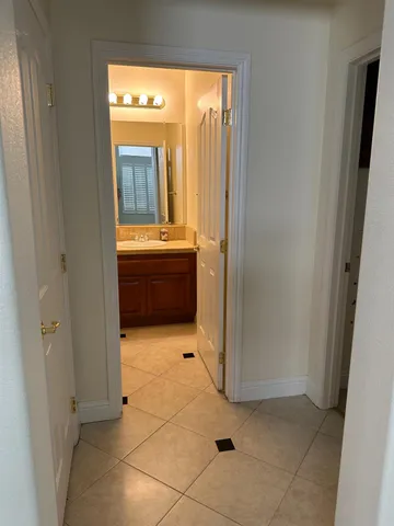 a bedroom with a bed and a cabinet